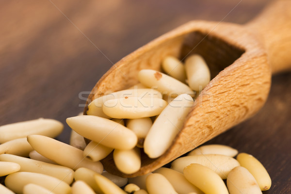 Dry Organic Pine Nuts on Wooden Background Stock photo © joannawnuk