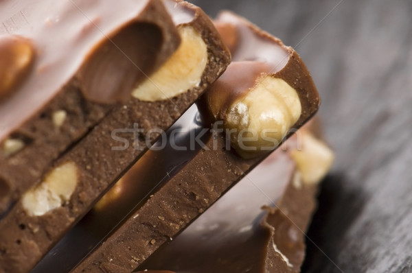 Pile of broken chocolate with nuts  Stock photo © joannawnuk