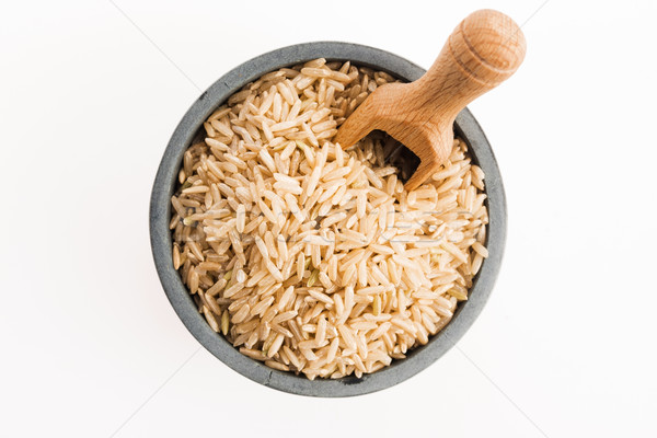 商业照片: 棕色    米    碗    孤立    白 / brown rice in   bowl