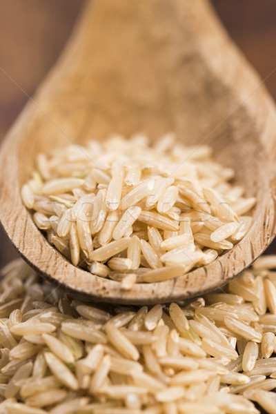 Spoon of brown rice close up Stock photo © joannawnuk