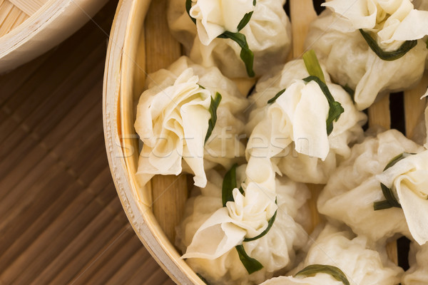 Chinese dumplings in bamboo steamers Stock photo © joannawnuk