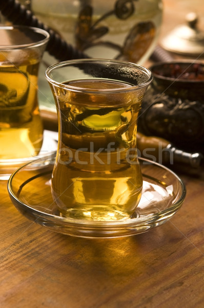 Stock photo: Cup of turkish tea and hookah served in traditional style