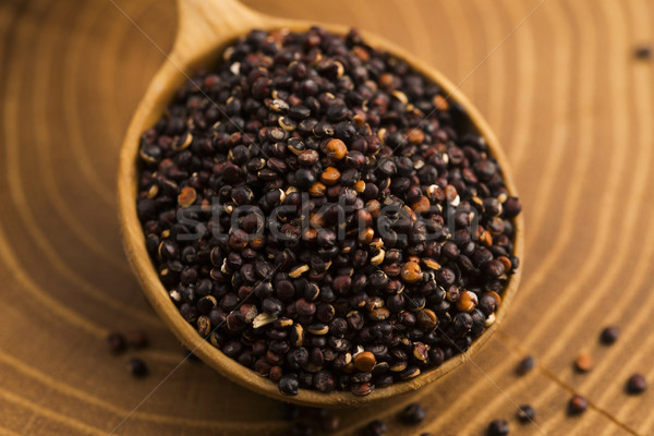 Black quinoa seeds on a wooden background Stock photo © joannawnuk
