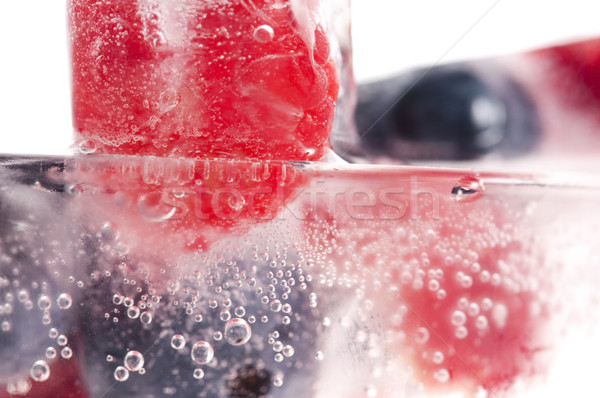 Raspberry and blackberry frozen in ice sticks Stock photo © joannawnuk