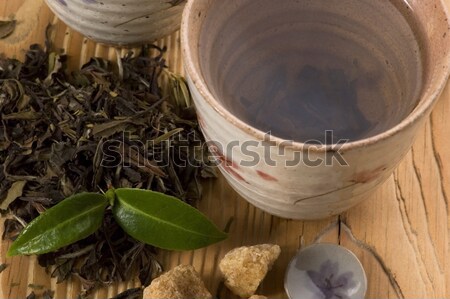 Groene thee blad thee vruchten goud beker Stockfoto © joannawnuk