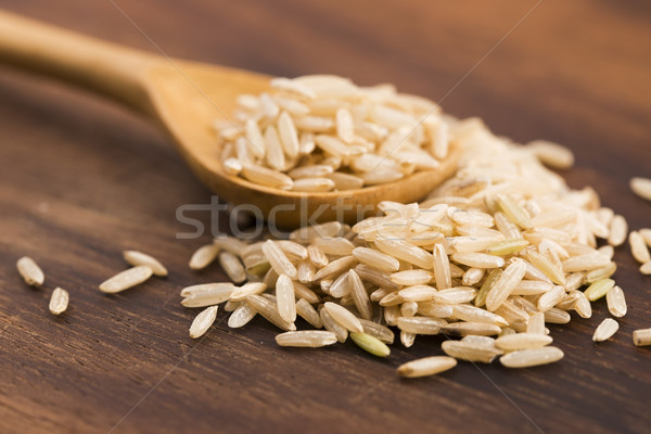 Spoon of brown rice close up Stock photo © joannawnuk