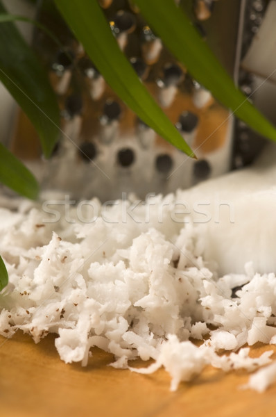 Grated coconut with grater and nut  Stock photo © joannawnuk