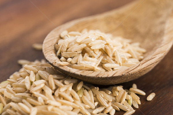 Spoon of brown rice close up Stock photo © joannawnuk