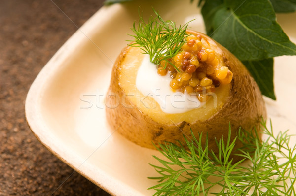 Baked potato with sour cream, grain Dijon mustard and herbs Stock photo © joannawnuk