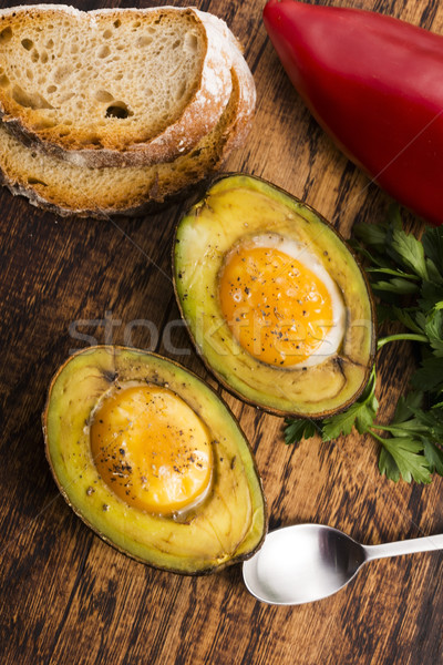 Homemade Organic Egg Baked in Avocado with Salt and Pepper Stock photo © joannawnuk