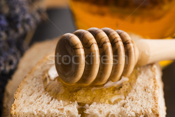 Bread and jar of lavender honey Stock photo © joannawnuk