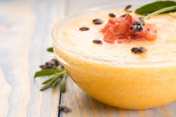 Stock photo: fresh melon soup with parma ham and lavender flower