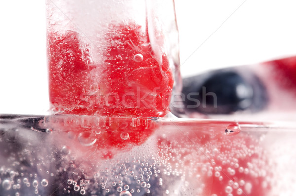 Raspberry and blackberry frozen in ice sticks Stock photo © joannawnuk