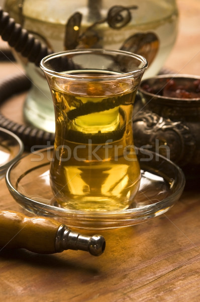 Cup of turkish tea and hookah served in traditional style Stock photo © joannawnuk