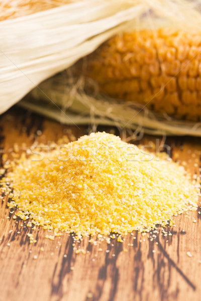 Corn groats and seeds, corncobs on wooden rustic table Stock photo © joannawnuk