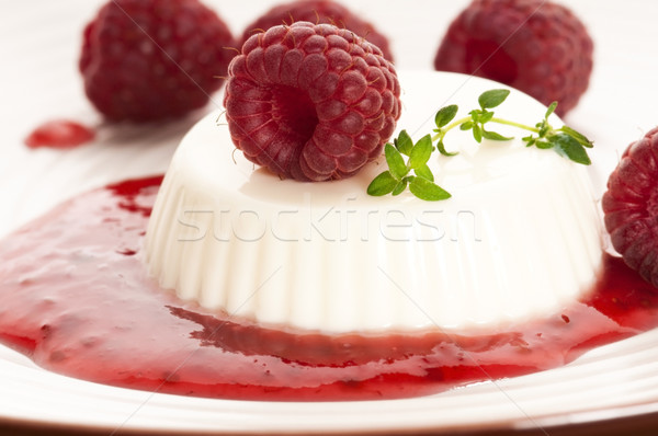 Vanilla panna cotta with berry sauce Stock photo © joannawnuk