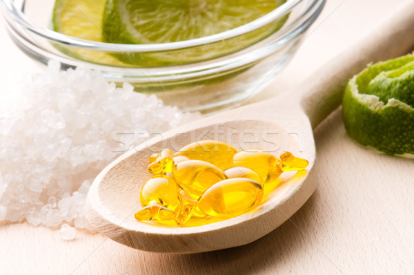 lemon bath - bath salt, capsule and fresh fruits Stock photo © joannawnuk