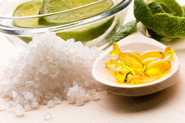 lemon bath - bath salt, capsule and fresh fruits Stock photo © joannawnuk