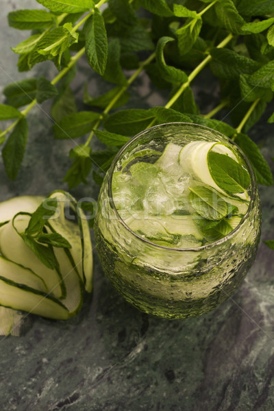 Refreshing detox cocktail with cucumber, mint and ice in glass Stock photo © joannawnuk