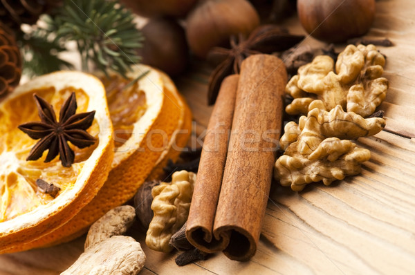 Different kinds of spices, nuts and dried oranges - christmas de Stock photo © joannawnuk