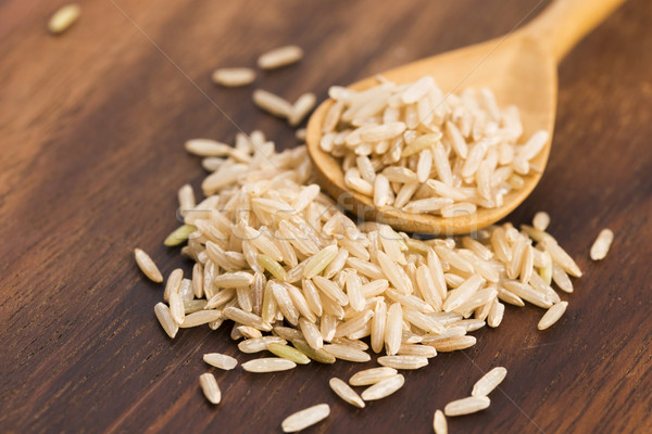 Spoon of brown rice close up Stock photo © joannawnuk