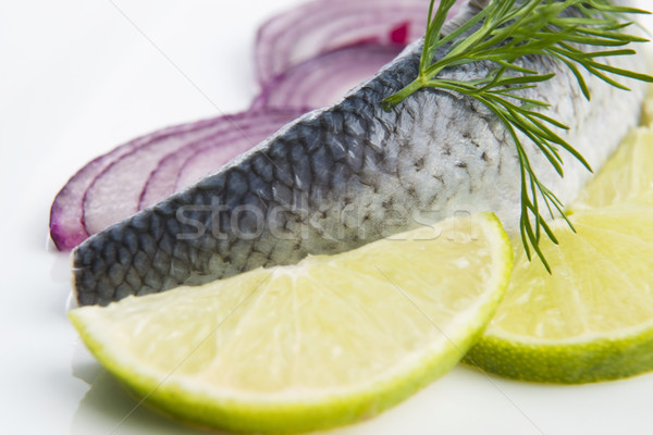 Stock photo: Fillet herring with onion and lemon