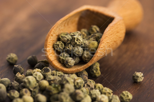 Green Peppercorns on wooden background Stock photo © joannawnuk