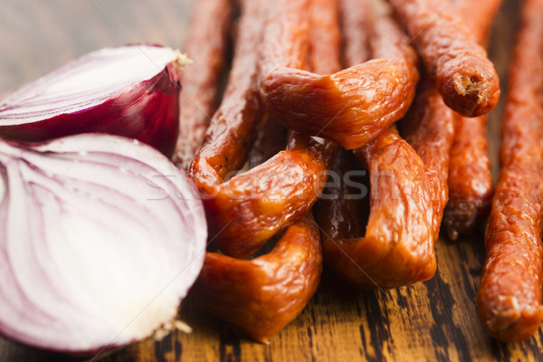 Stock photo: Snack stick sausage with onion