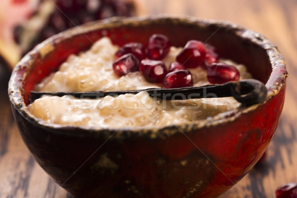 A bowl of tapioca pudding with vanilla and pomegranate Stock photo © joannawnuk