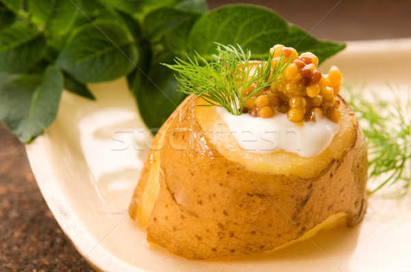 Baked potato with sour cream, grain Dijon mustard and herbs Stock photo © joannawnuk