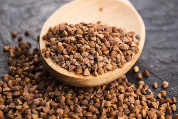 Buckwheat seeds on wooden spoon in closeup  Stock photo © joannawnuk