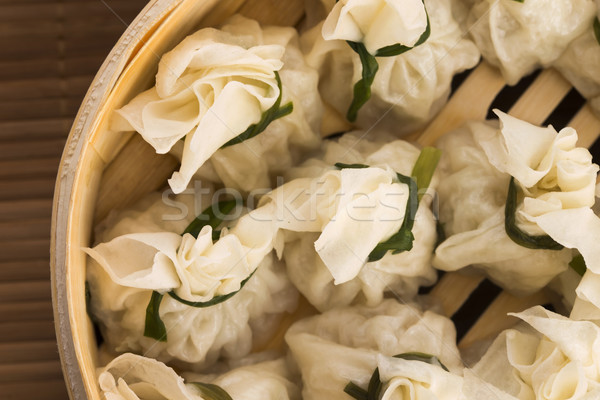 Chinese dumplings in bamboo steamers Stock photo © joannawnuk