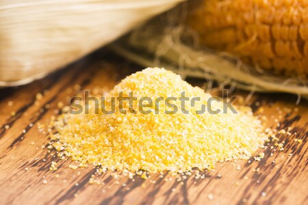 Corn groats and seeds, corncobs on wooden rustic table Stock photo © joannawnuk