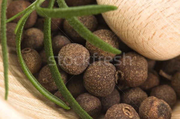 Mortar with fresh herbs and allspice berries Stock photo © joannawnuk