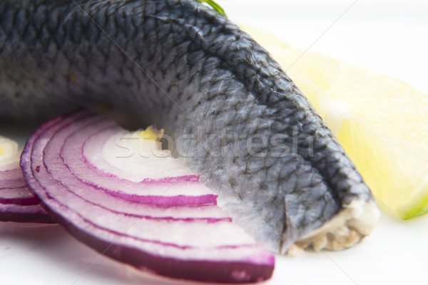 Fillet herring with onion and lemon Stock photo © joannawnuk