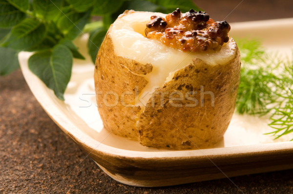 Baked potato with sour cream, grain Dijon mustard and herbs Stock photo © joannawnuk