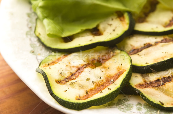 Grilled organic zucchini slices with herbs and spices Stock photo © joannawnuk
