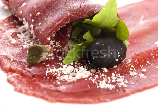 Beef carpaccio with rucola and parmesan  Stock photo © joannawnuk