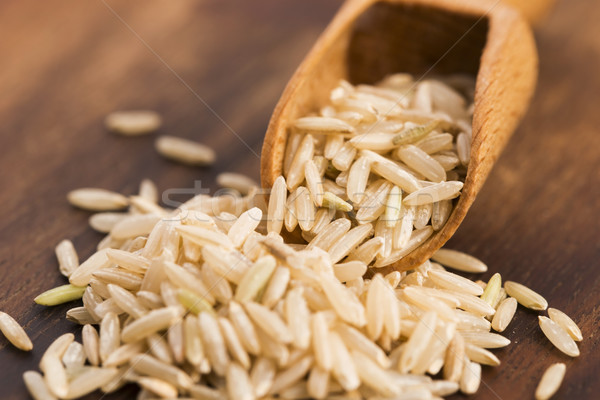 Spoon of brown rice close up Stock photo © joannawnuk