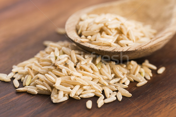 Spoon of brown rice close up Stock photo © joannawnuk