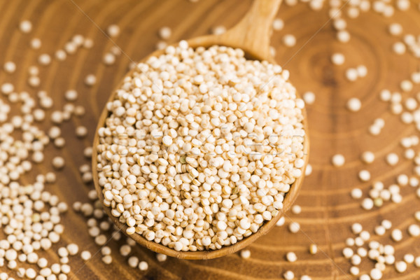 White quinoa seeds on a wooden background Stock photo © joannawnuk