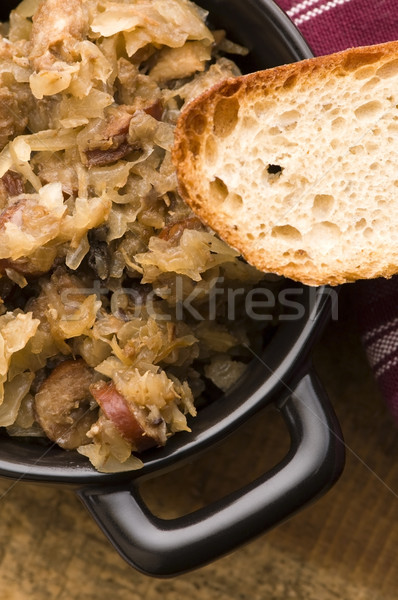 traditional polish sauerkraut (bigos) with mushrooms and plums f Stock photo © joannawnuk