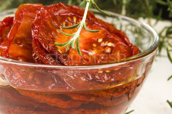 Sun dried tomatoes with olive oil Stock photo © joannawnuk