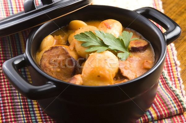 Beans with sausage, bacon and tomatoes Stock photo © joannawnuk