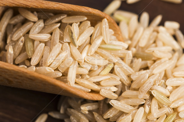 Spoon of brown rice close up Stock photo © joannawnuk