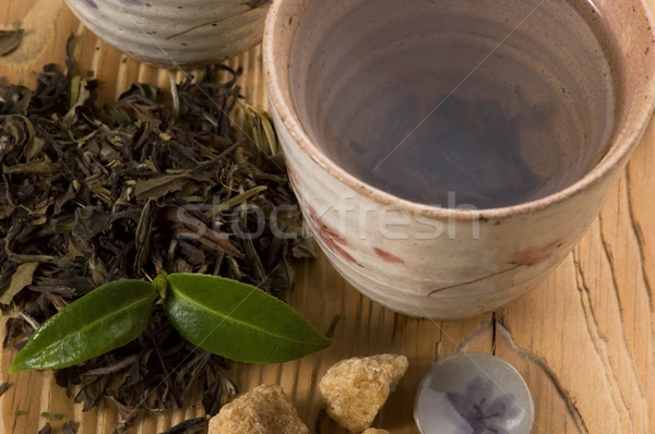 Groene thee blad thee goud beker japans Stockfoto © joannawnuk