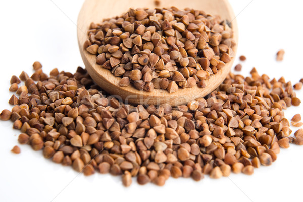 Buckwheat seeds on wooden spoon in closeup  Stock photo © joannawnuk