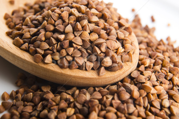 Buckwheat seeds on wooden spoon in closeup  Stock photo © joannawnuk