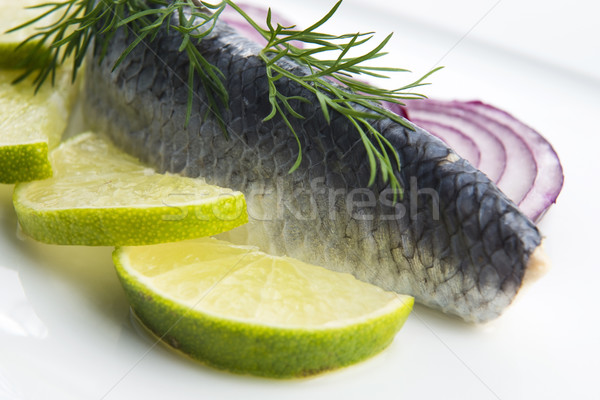 Stock photo: Fillet herring with onion and lemon