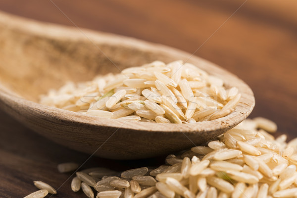 Spoon of brown rice close up Stock photo © joannawnuk